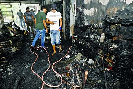 An old woman dies of suffocation and three others injured as fire gutted the third floor of 12-storey building located at Dhanmondi on Saturday.