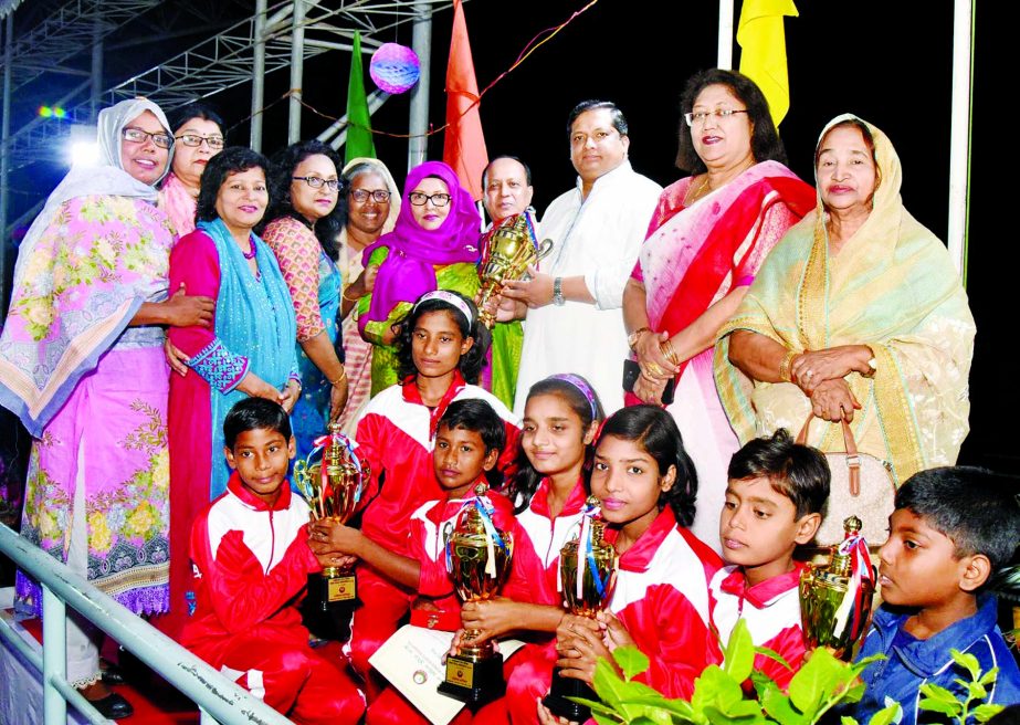 Members of Kushtia District Sports Association team, the champions in the National Junior Women's Swimming Competition with the chief guest State Minister for Youth and Sports Zahid Ahsan Russell and the officials of Bangladesh Women's Sports Federation