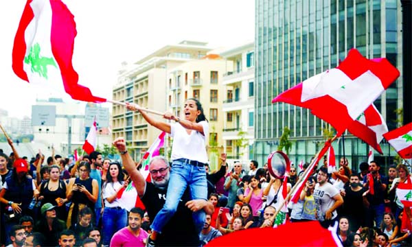 Demonstrators across Lebanon blocked roads and took to the streets on Saturday for a 10th consecutive day, defying what they said were attempts by Hezbollah to defuse their movement and despite tensions with the army.