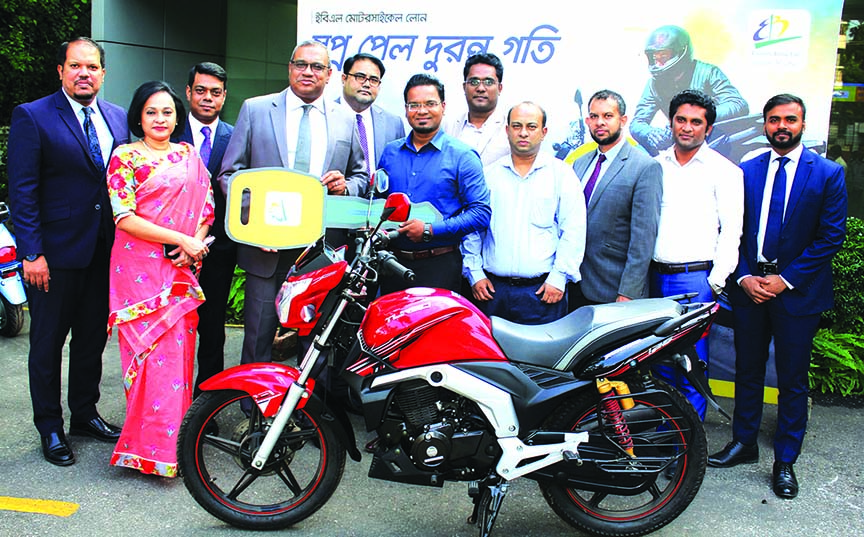 M. Khorshed Anowar, Head of Retail and SME Banking of Eastern Bank Limited, handing over a two wheeler's key to their first loan customer at its head office in the city on Sunday. Runner Motors becomes the first vendor to sell bikes under the programme.