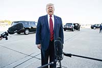 President Donald Trump talks to reporters before boarding Air Force One for a trip to Chicago to attend the International Association of Chiefs of Police Annual Conference and Exposition, on Monday in Andrews Air Force Base, Md.