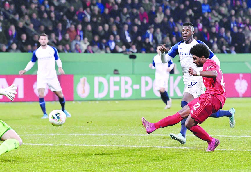 Bayern's Serge Gnabry (right) takes a shot at goal, during the German soccer cup, DFB Pokal, second round match between VfL Bochum and Bayern Munich at the Vonovia Ruhrstadion stadium in Bochum, Germany on Tuesday.