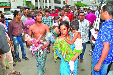 Critically injured children are being rushed to Dhaka Medical College Hospital by their parents following the balloon gas cylinder blast near a school in Rupnagar Residential area of Dhaka on Wednesday afternoon. Six children were also killed (not seen) d