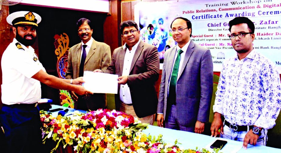 Head of Corporate Communications and PR, bKash Limited handing over certificates among the participants in a training workshop on 'PR , Communication and Digital Publicity' organised by Bangladesh Institute of Journalism and Electronics Media in its a