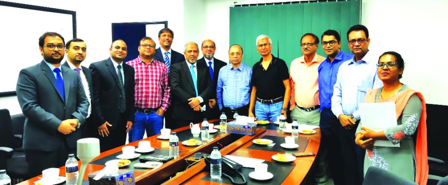Syed Hammadul Karim, General Manager of MetLife Bangladesh and Md. Rafiquzzaman, Managing Director of ACE Consultants Limited, along with other officials from both sides poses for a photograph after signing an agreement at MetLife office in the city on Tu