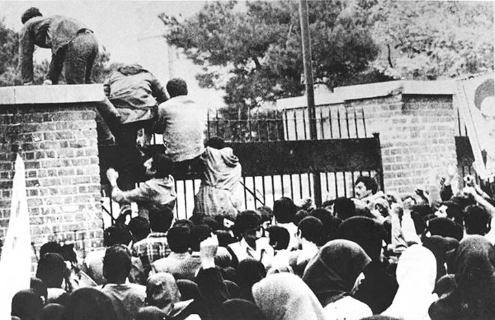 Iranian revolutionary students climb the American embassy's gate in Tehran on November 4, 1979 less than nine months after the toppling of the US-backed Shah. AP file photo