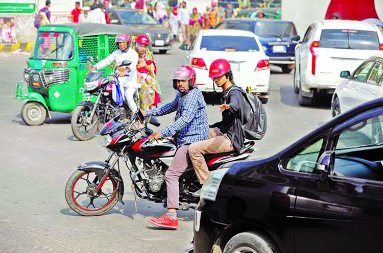 Several vehicles and motor cyclists haphazardly plying on city roads as new Road Transport Act being implemented from Friday. This photo was taken from Shahbagh area.