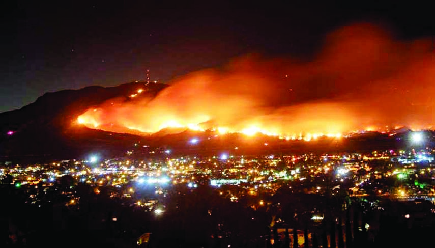 A long exposure photo shows the Maria Fire as it races across a hillside in Santa Paula, California. Internet photo