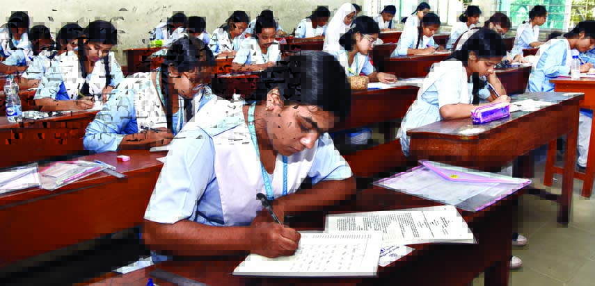 Candidates sit for the JSC exam at the Motijheel Ideal School center in Dhaka on Saturday.