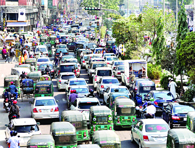 Thousands of vehicles got stuck in a long queue of huge traffic gridlock in city despite public holiday on Saturday. This photo was taken from Kakrail area.