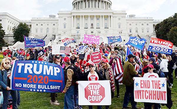 Supporters of US President Donald Trump hold a "Stop Impeachment" rally in Washington, DC. America on Sunday kicks off the one-year countdown to Election Day 2020, with President Donald Trump betting an "angry" Republican surge can deliver him a secon