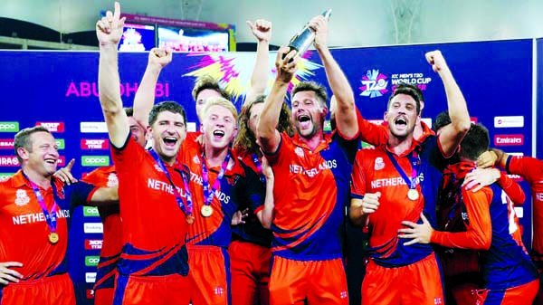 Members of Netherlands Cricket team celebrate after winning the ICC Men's T20 World Cup Qualifier 2019 title beating Papua New Guinea by seven wickets in the final at the Dubai International Cricket Stadium on Saturday.