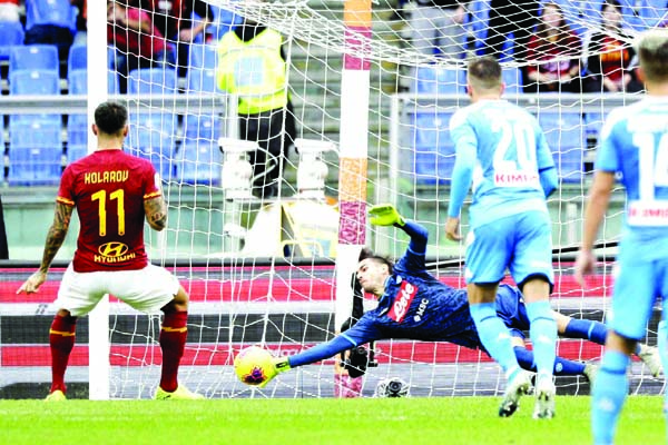 Napoli's goalkeeper Alex Meret saves on a penalty kick by Roma's Aleksandar Kolarov ( left) during an Italian Serie A soccer match between Roma and Napoli, at the Olympic stadium in Rome on Saturday.