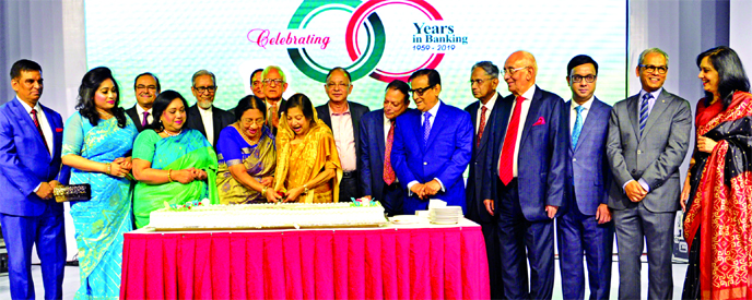 Md. Ashadul Islam, Senior Secretary of Financial Institutions Division of Finance Ministry along with Hafiz Ahmed Mazumder, MP, Chairman of Bangladesh Redcrescent Society, inaugurating the diamond jubilee programme (60 years of operation) of Pubali Bank L