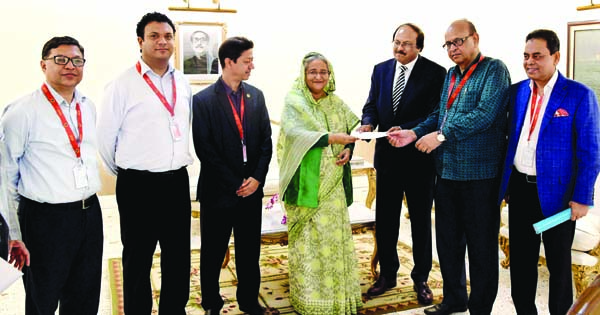 Prime Minister Sheikh Hasina handing over a cheque of grant aid to Speaker Humayun Rashid Chowdhury Smrity Parishad at her office on Monday. BSS photo