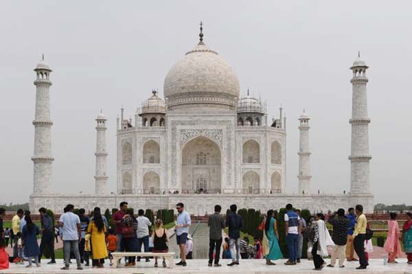 Tourists visiting the Taj Mahal in Agra.