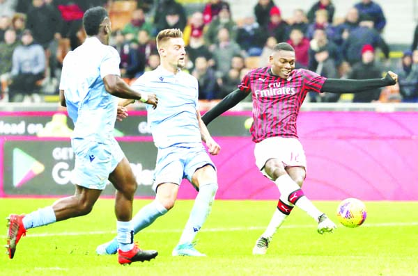 AC Milan's Rafael Leao (right) trys to score during the Serie A soccer match between AC Milan and Lazio at the San Siro stadium, in Milan, Italy on Sunday.