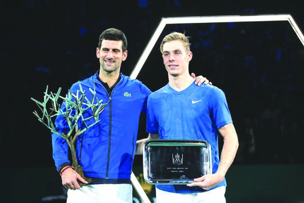 Novak Djokovic (left) of Serbia and Denis Shapovalov of Canada pose during the awarding ceremony after the final match at the Rolex Paris Masters 1000 held at the AccorHotels Arena in Paris, France on Sunday.