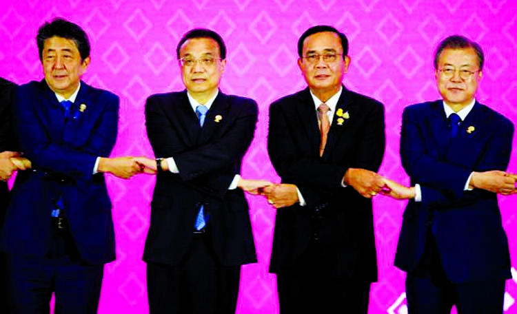 Japan's Prime Minister Shinzo Abe, China's premier Li Keqiang, Thailand's Prime Minister Prayut Chan-O-Cha and South Korea's President Moon Jae-in a group photo during the 22nd ASEAN Plus Three Summit in Bangkok on Monday.