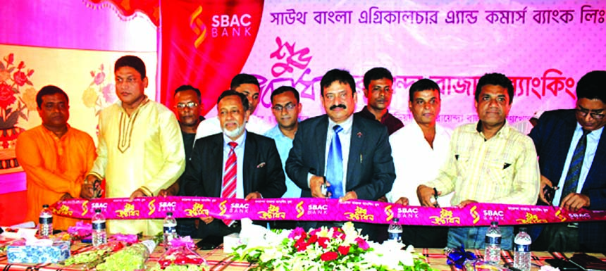 Mostafa Jalal Uddin Ahmed, AMD of South Bangla Agriculture and Commerce (SBAC) Bank Limited, inaugurating its Banking Booth at Rayenda Bazar of Shoronkhola in Bagerhat on Wednesday. Md. Hafizur Rahman, Head of GSD, SM Iqbal Mehedi, EVP of the bank and loc