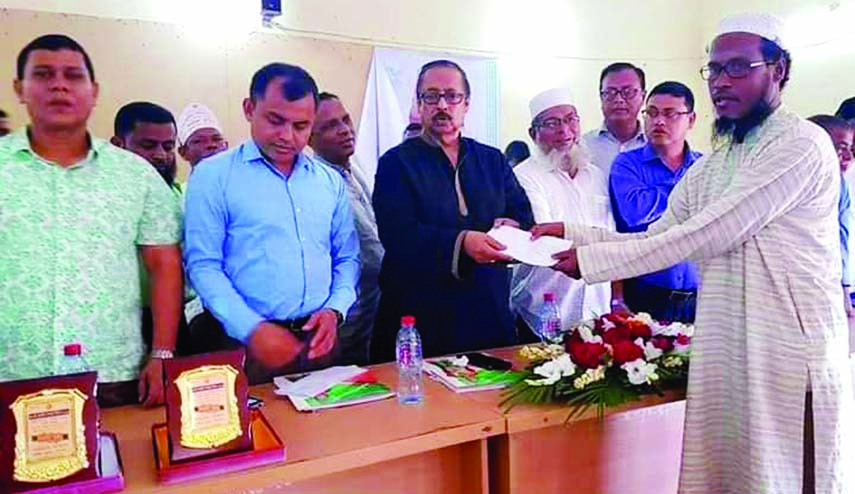 SYLHET: Mahmud- us -Samad Chowdhury MP distributing cheques among the different social organisations at Dakhin Surma Upazila organised by Social Welfare Office recently.