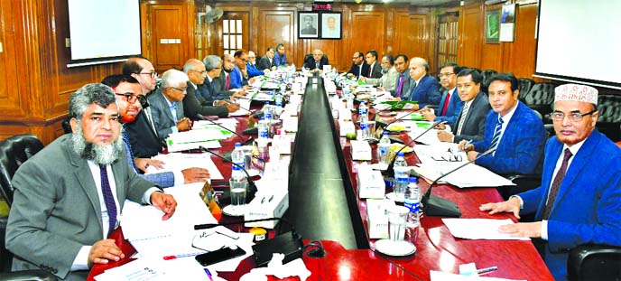 Professor Md. Nazmul Hassan, Chairman of Islami Bank Bangladesh Limited, presiding over its Board of Directors meeting at the bank's head office in the city on Thursday. Md. Shahabuddin, Vice-Chairman, Md. Mahbub ul Alam, CEO and other Directors of the b