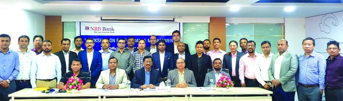 Md. Mehmood Husain, CEO of NRB Bank Limited poses for photograph with the participants of a day-long workshop on "Performance Management" at the bank's Learning & Development Center in the city on Saturday. Md. Khurshed Alam, DMD, Mohammed Golam Nakib,