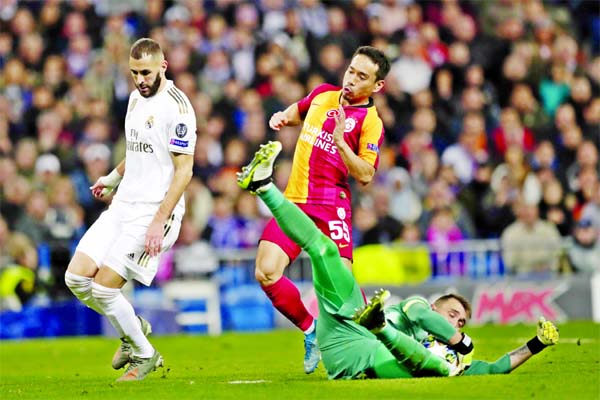 Galatasaray's goalkeeper Fernando Muslera, makes a save during a Champions League group A soccer match between Real Madrid and Galatasaray at the Santiago Bernabeu stadium in Madrid on Wednesday.