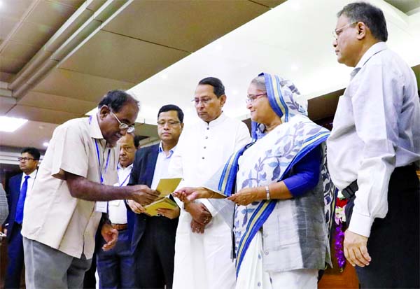 Prime Minister Sheikh Hasina handing over cheques of financial assistance to journalists suffering from various diseases, financial insolvency and the family members of the journalists who died in different incidents. The photo was taken from PMO on Thur