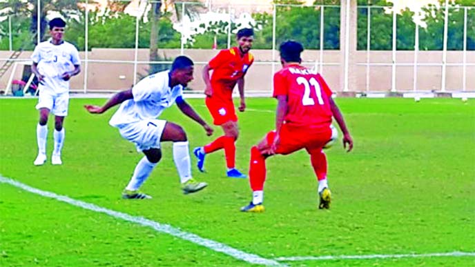 An action from the practice football match between Bangladesh National Football team and Muscat Club of Oman, at Muscat, the capital city of Oman on Thursday.