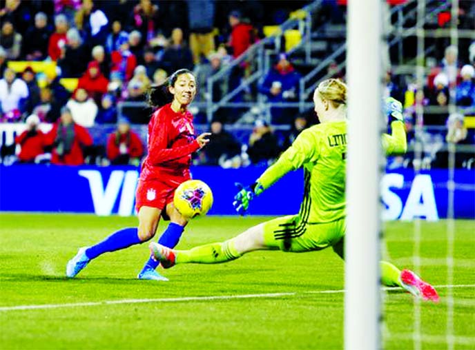 United Statesâ€™ forward Christen Press (left) scores past Sweden goalkeeper Hedvig Lindahl during the first half of a women's international friendly soccer match in Columbus, Ohio on Thursday.