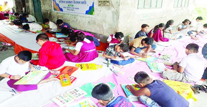 MIRZAPUR (Tangail): Children participating in a art competition on the occasion of the 10th founding anniversary of Mohona TV at Sheikh Russel Stadium at Mirzapur Upazila on Sunday.