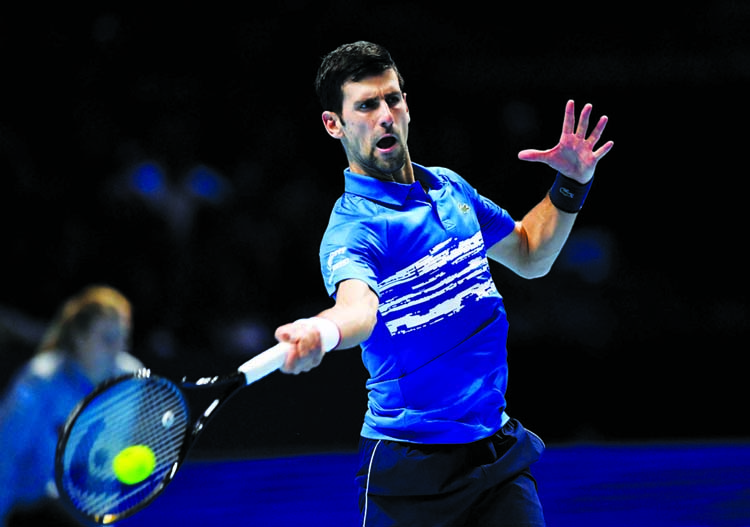 Serbia's Novak Djokovic in action during his group stage match against Italy's Matteo Berrettini in London, Britain on Sunday.