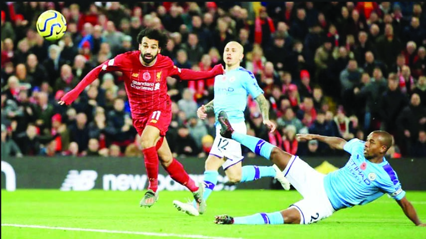 Mohamed Salah (left) scored Liverpool's 2nd goal against defending champions Manchester City at Anfield on Sunday.