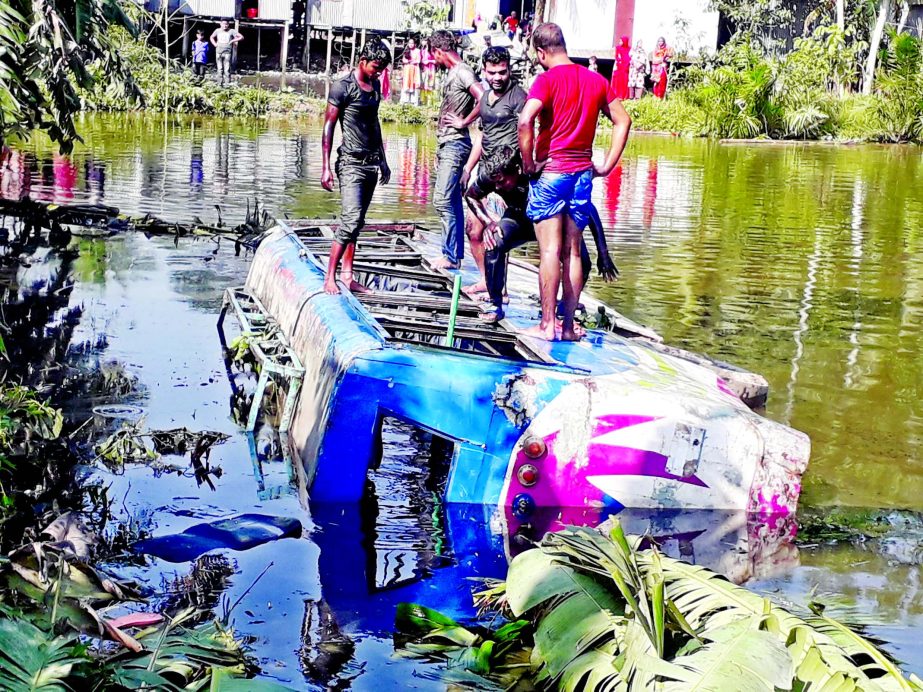 A passenger bus plunged into a roadside pond at Rishibari area of Damuddya in Shariatpur district on Tuesday after the driver lost control on steering leaving at least two passengers dead and 15 others injured.