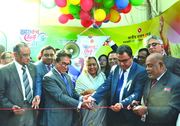 Finance Minister AHM Mustafa Kamal along with NBR Chairman Mosharraf Hossain Bhuiyan and high officials from concerned office, inaugurating the Tax Fair-2019 at Officers Club in the city on Thursday.