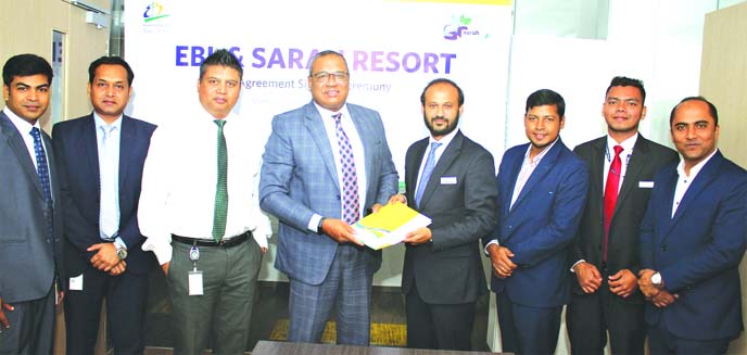M Khorshed Anowar, Head of Retail and SME Banking of Eastern Bank Limited (EBL) and Ahmad Raquib, General Manager (Branding, Sales and Reservation) of Sarah Resort Limited, exchanging documents after signing an agreement at the bank's head office in the