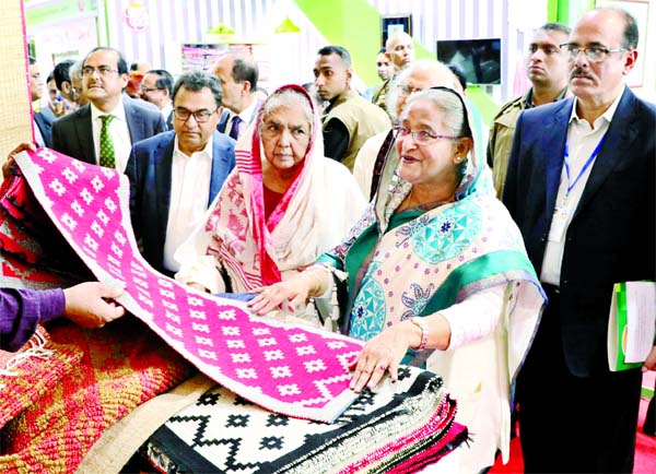 Prime Minister Sheikh Hasina visiting a stall after inauguration of Palli Karma-Sahayak Foundation (PKSF) Unnayan Mela 2019 at the Bangabandhu International Conference Centre on Thursday.