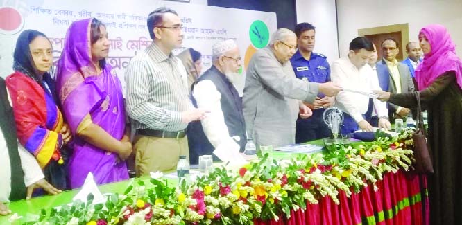 SYLHET: Expatriate Welfare and Overseas Employment Minister Imran Ahmed MP distributing sewing machines among the trainees organised by Sylhet Zila Parishad recently. .