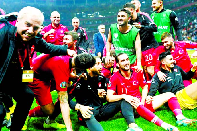 Members of Turkey Football team celebrate after making a goalless draw with Iceland in UEFA Euro 2020 qualifying first round football match on Thursday.