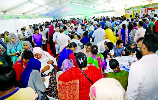The Income Tax Fair 2019 wore a festive look on Friday as hundreds of taxpayers rushed to its venue at the Officers Club in Dhaka to avail themselves of various tax-related services under one roof without any hassle on the second day of the weekly holiday