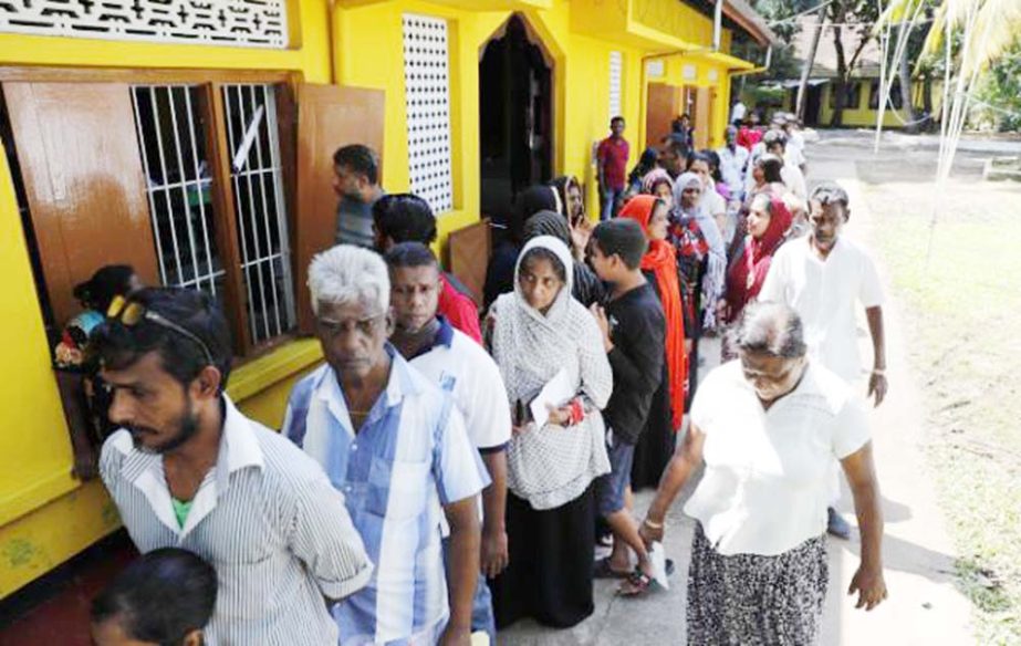 Sri Lankans queue to cast their votes at a polling station during the presidential election in Colombo, Sri Lanka on Saturday.