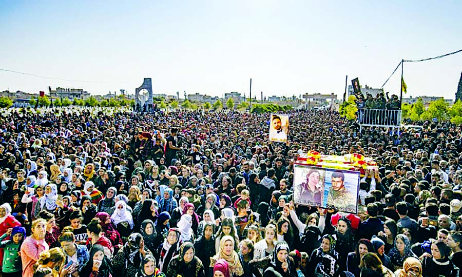 Mourners carry coffins at a funeral procession for Syrian Democratic Forces (SDF) fighters in the Syrian Kurdish-majority city of Qamishli. Internet photo