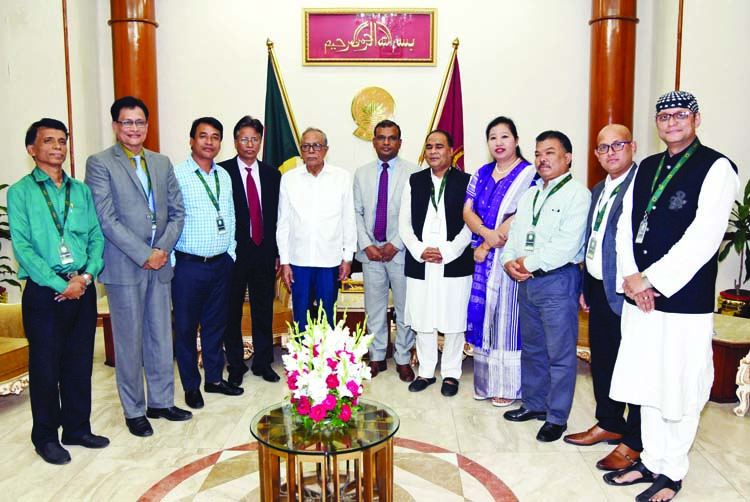 President Abdul Hamid poses for a photo session with the members of Trustee Board of Bouddha Religious Welfare Trust when they called on President at Bangabhaban on Monday. Press Wing, Bangabhaban photo
