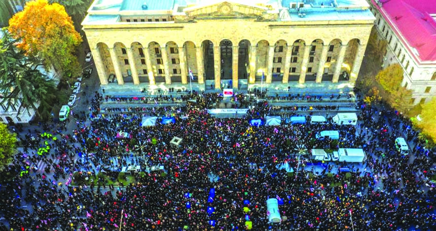 More than 20,000 demonstrators rallied outside the Parliament building in Tbilisi urging the government to resign and calling for new legislative elections.