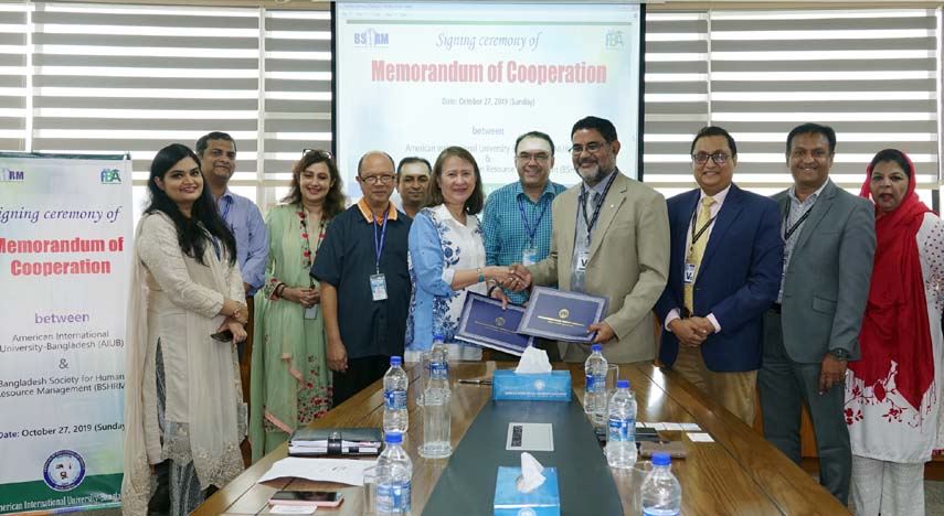 Dr Carmen Z Lamagna, Vice Chancellor of American International University - Bangladesh and Mashequr Rahman Khan, President of Bangladesh Society for Human Resource Management exchange documents of a MoC signed between the organizations in a ceremony held