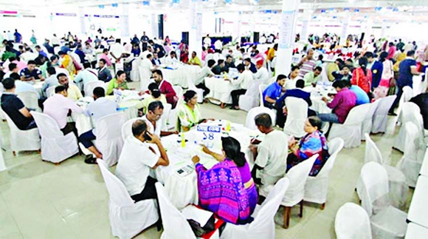People are seen filling up their tax returns at the city's GEC convention Centre under Chattogram Income Tax Zone on Sunday.