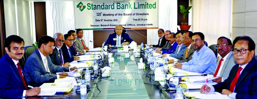 Kazi Akram Uddin Ahmed, Chairman of Standard Bank Limited, presiding over its 320th Board of Directors Meeting at the bank's head office in the city on Monday. Kamal Mostafa Chowdhury, Ashok Kumar Saha, Ferozur Rahman, S A M Hossain, Mohammed Abdul Aziz,