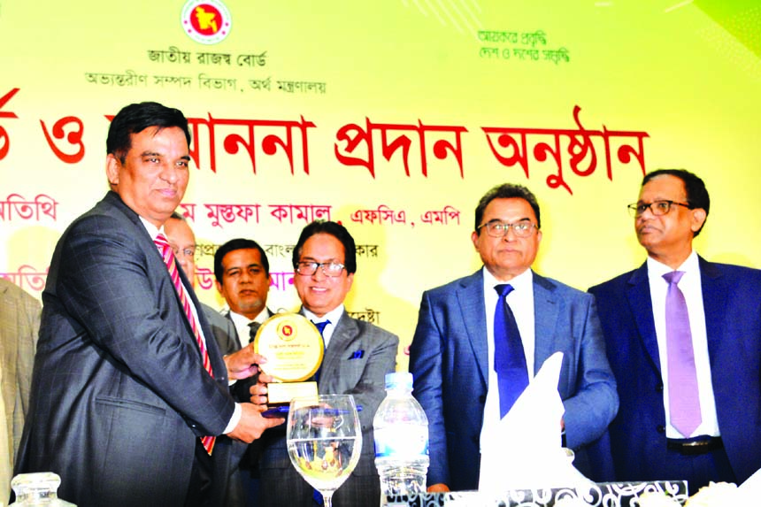 Md. Abdul Halim Chowdhury, Managing Director of Pubali Bank Limited, receiving the Crest & Tax Card from Md. Mosharraf Hossain Bhuiyan, Chairman of National Board of Revenue (NBR), as the highest tax-payer in the banking category under the large tax payer