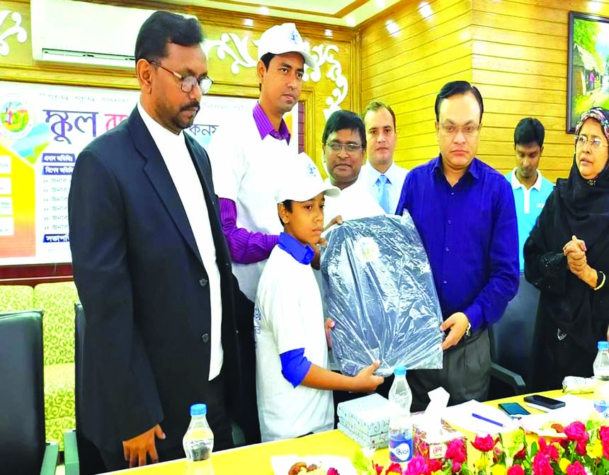 Mohammad Jakir Hossain, Deputy Commissioner of Joypurhat, handing over the educational materials among the students as the chief guest at "School Banking Conference 2019" organized by Prime Bank Limited at Joypurhat Sadar recently while Mohammad Salam K